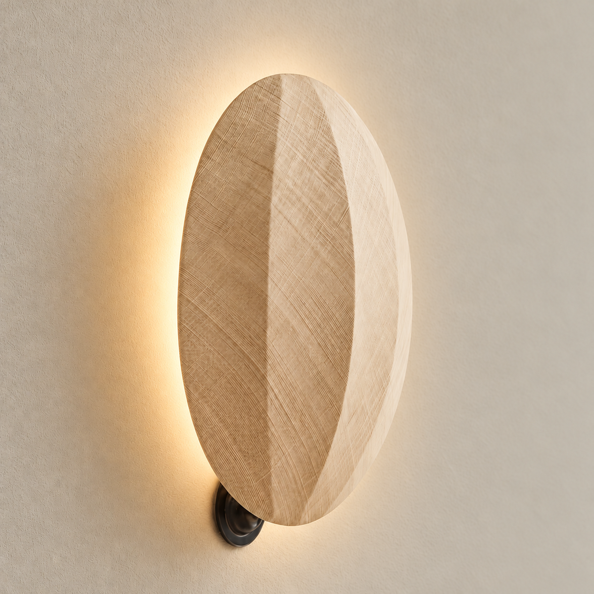 Oak disc wall sconce with concealed backlighting illuminated.
