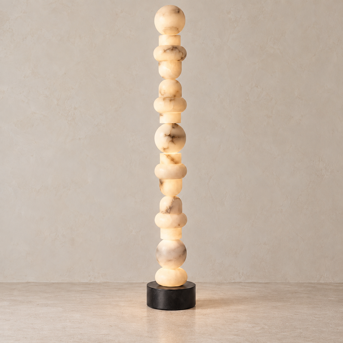 Grenaldi floor lamp illuminated, showing light passing through the alabaster's natural clouds and mineral bands.