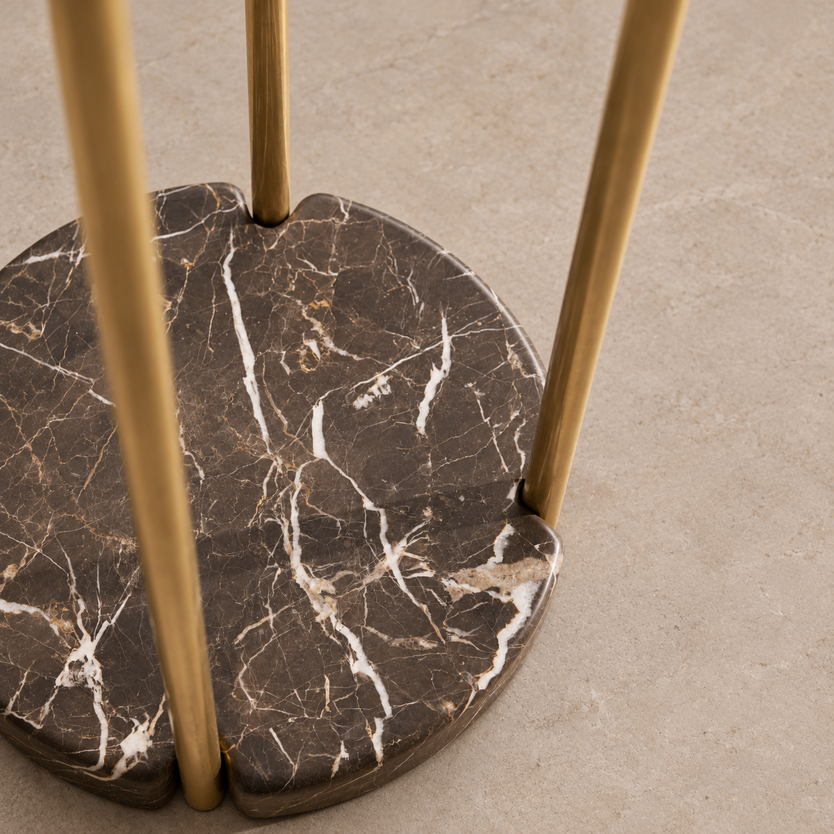 Dark brown marble base of CLKPS0294 with white veining and brass supports seated in edge notches.