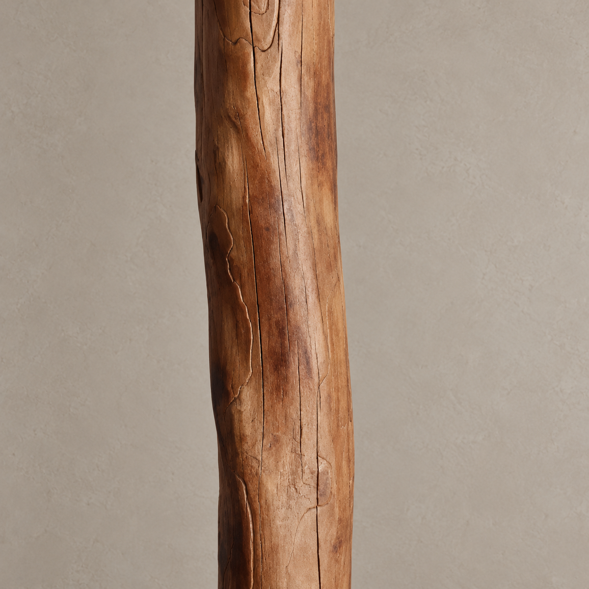 Close view of Legno Rustico’s solid wood column, showing natural grain, splits and irregular contours.