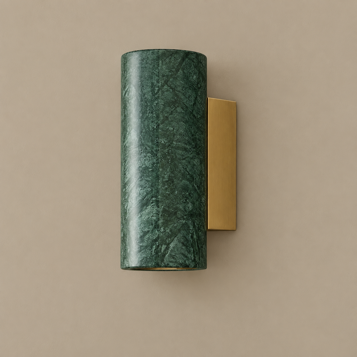 Marble block and brass wall sconce, green round version, unlit on a stone-beige wall