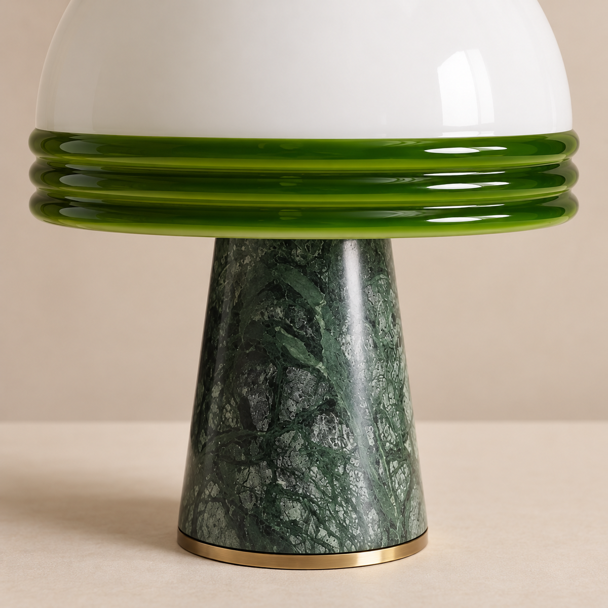 Close-up of green glass bands and veined marble.