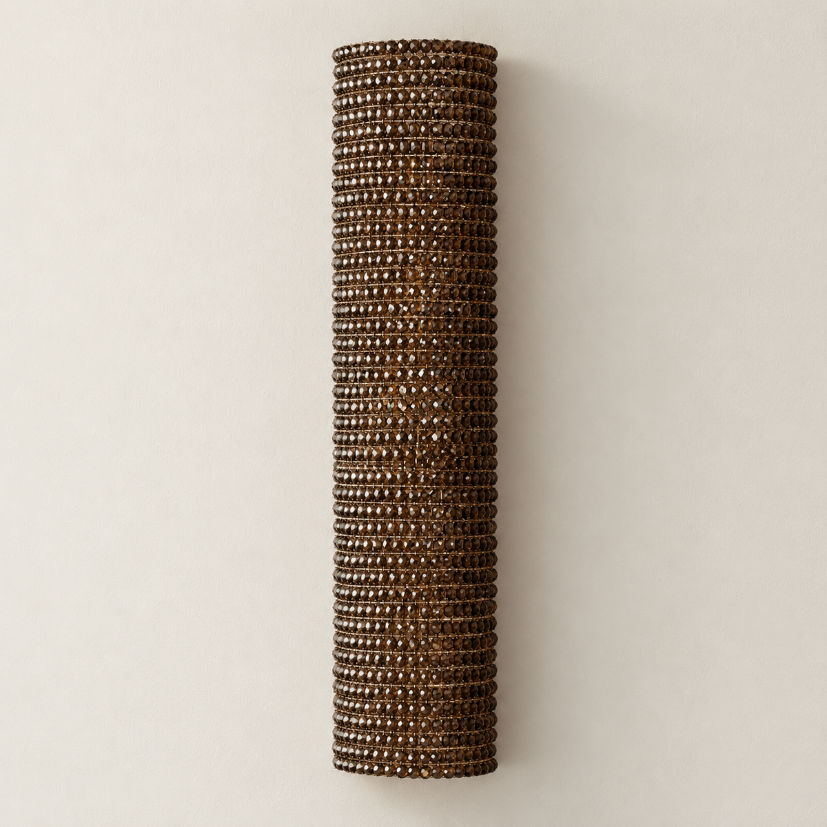 90 cm amber crystal column wall sconce, switched off against ivory plaster.