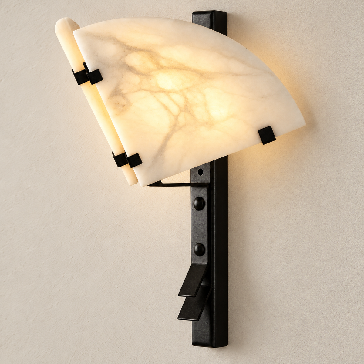 Alabaster fan wall sconce illuminated, showing its natural mineral pattern.