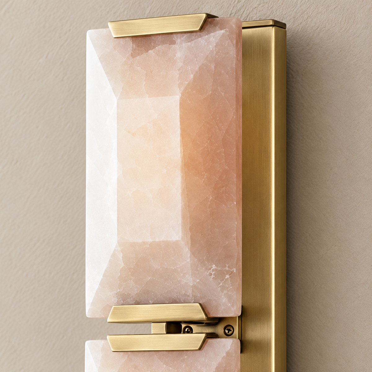 Detail of bevelled calcite and brass mounting hardware.