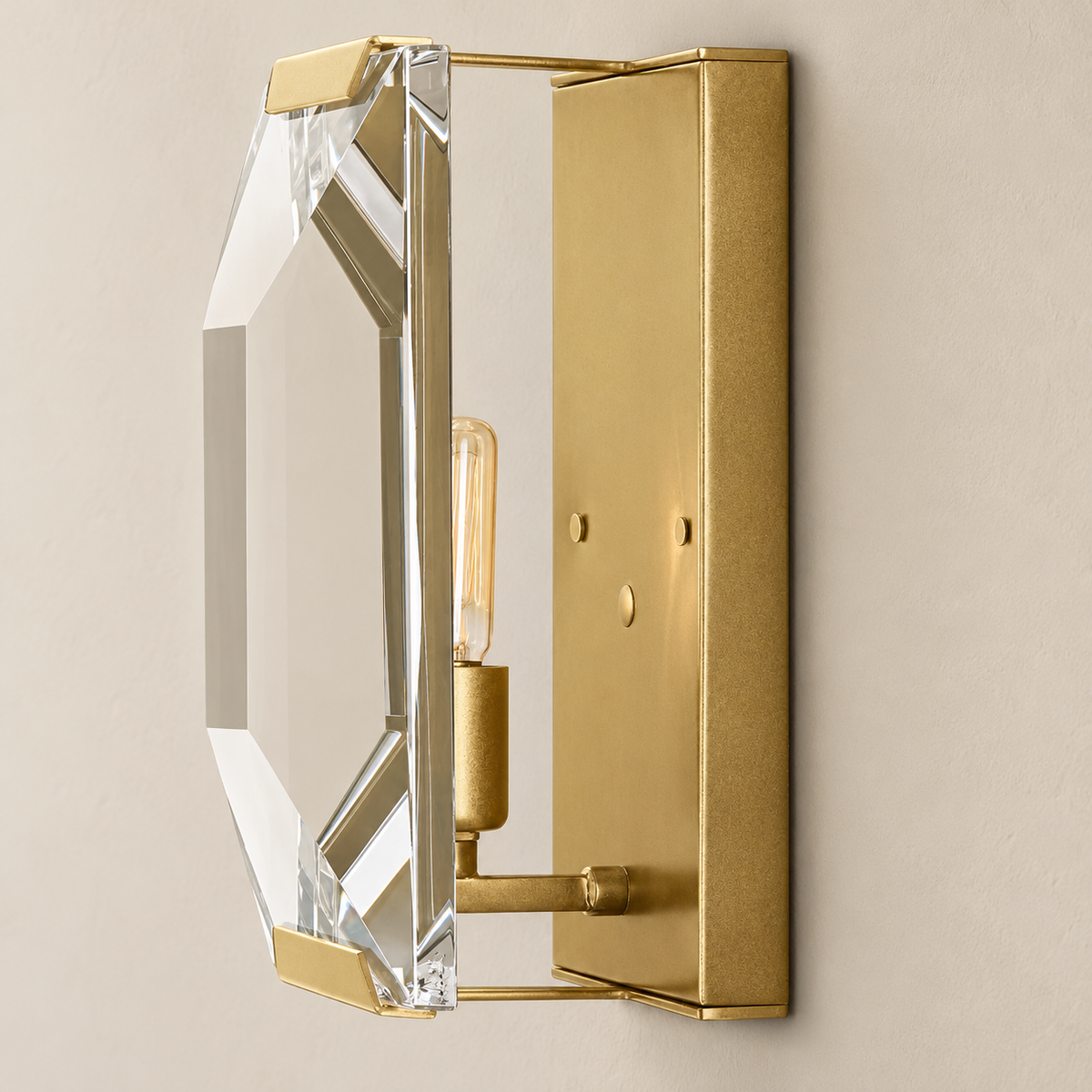 Angled view showing the crystal sconce’s brass backplate, bulb holder and deep beveled panel.