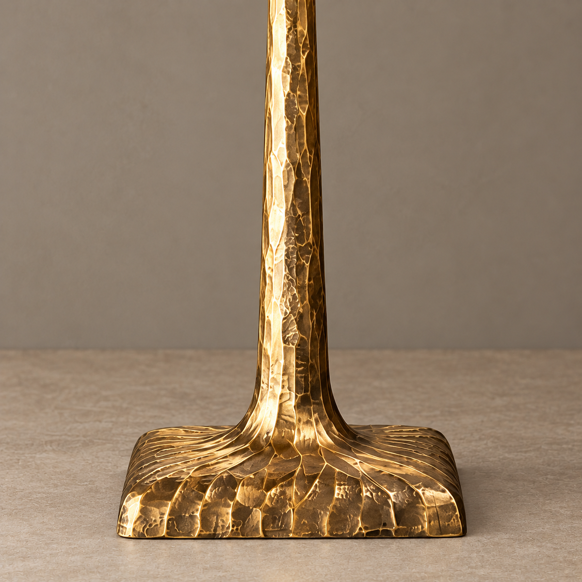Close-up of the hammered metal stem and flared base.