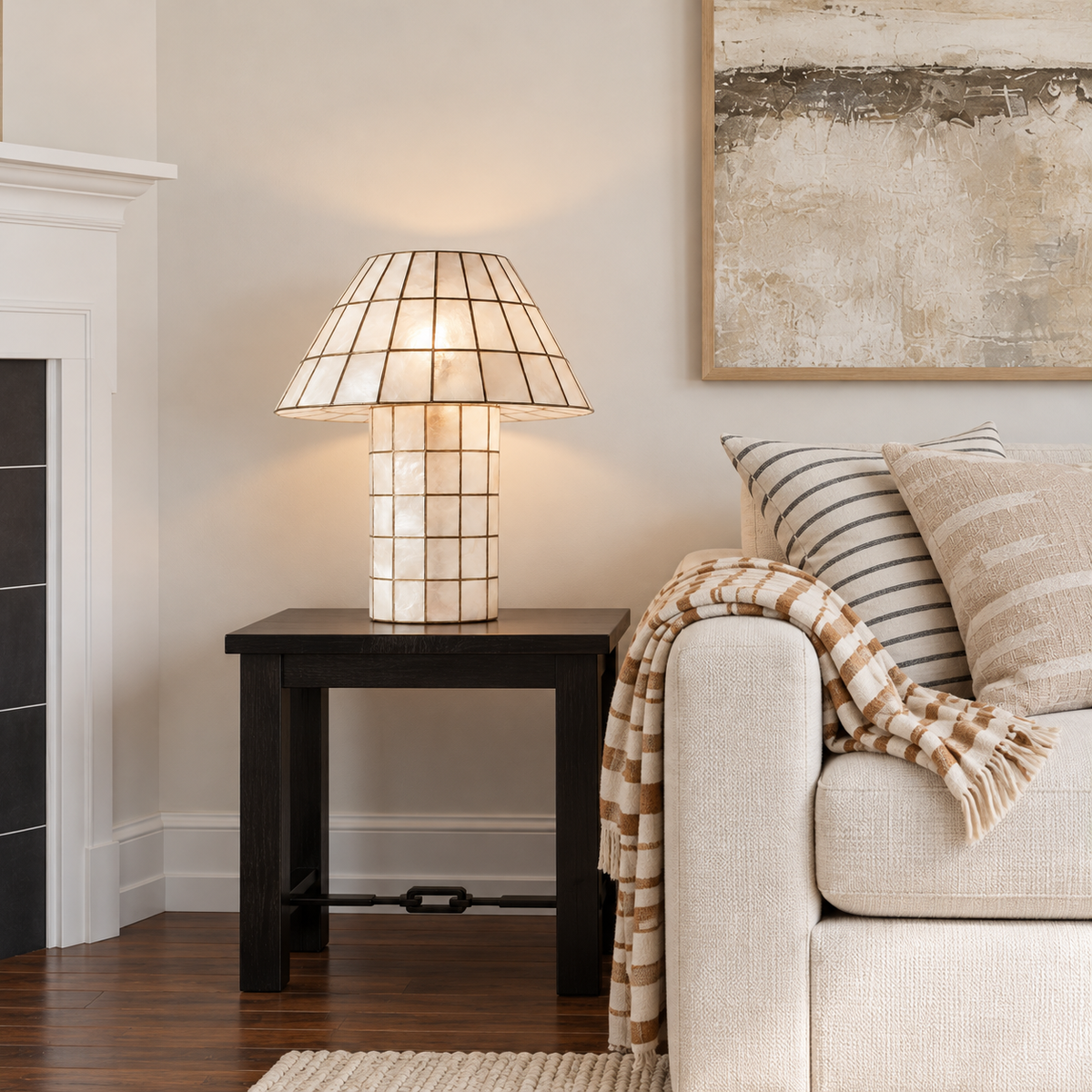 Capiz shell table lamp with a bronze grid, placed in a living room setting