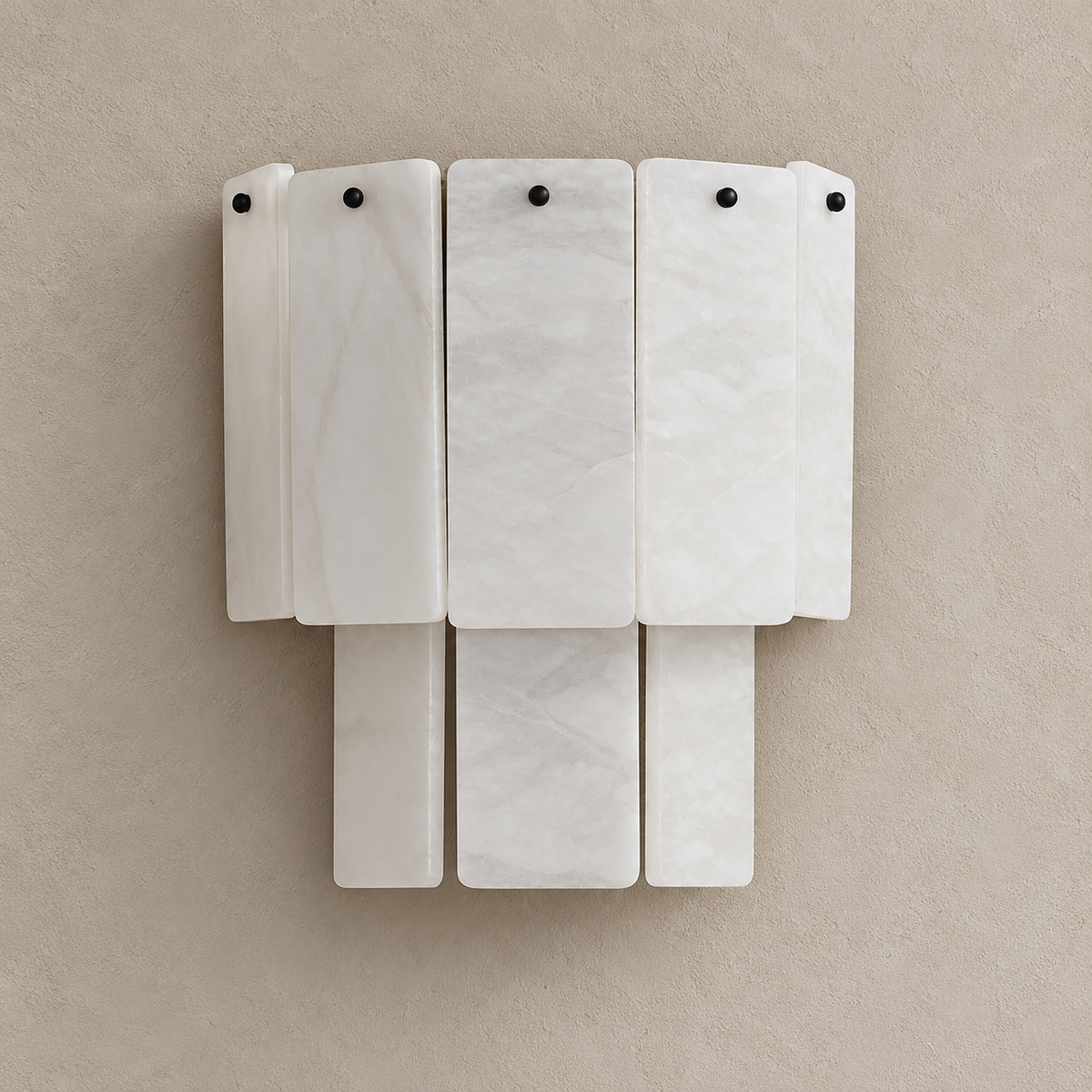 Walter layered alabaster wall sconce, switched off on a beige wall.
