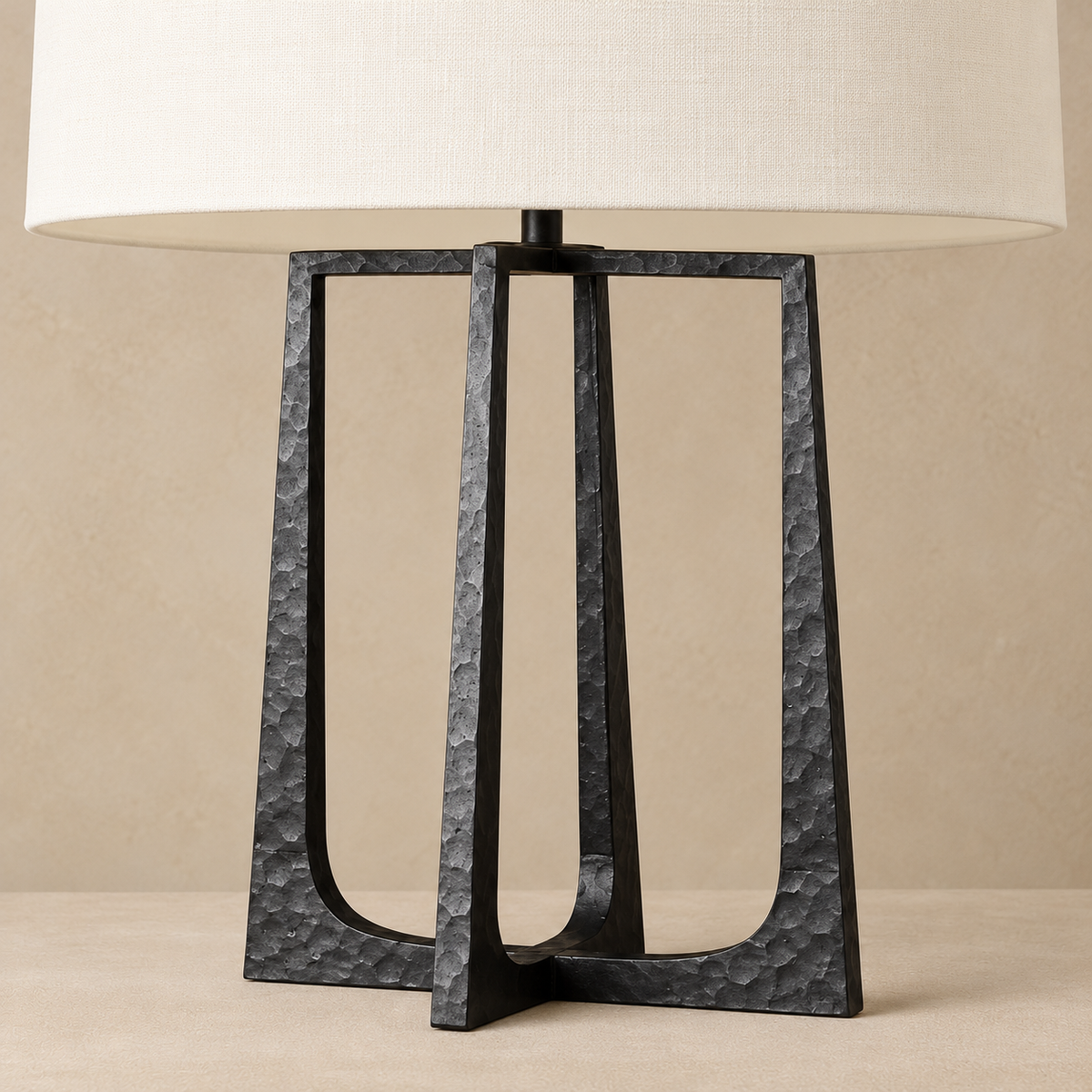 Close view of the hammered open-frame base and fabric shade.