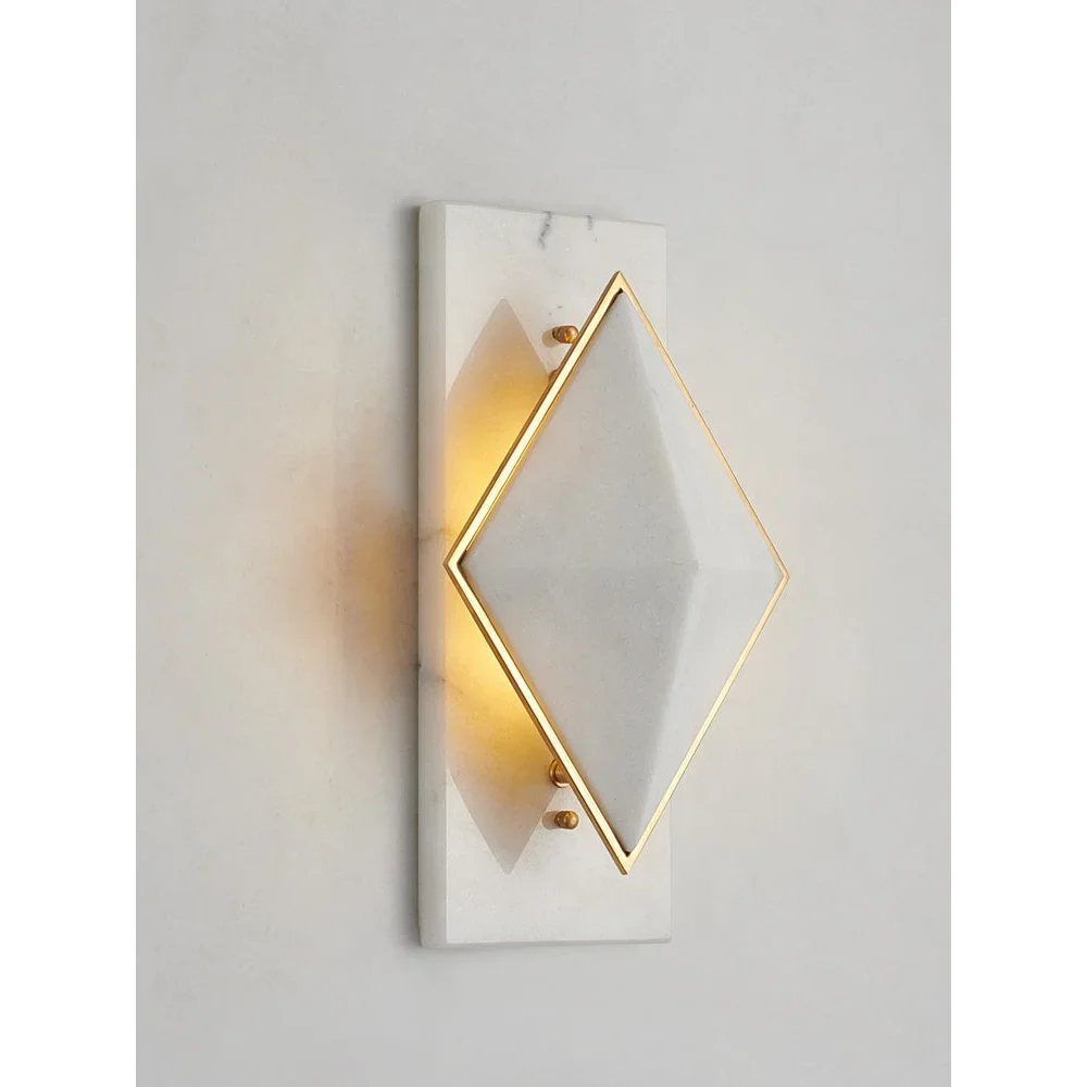 Geometric alabaster sconce in a bedroom