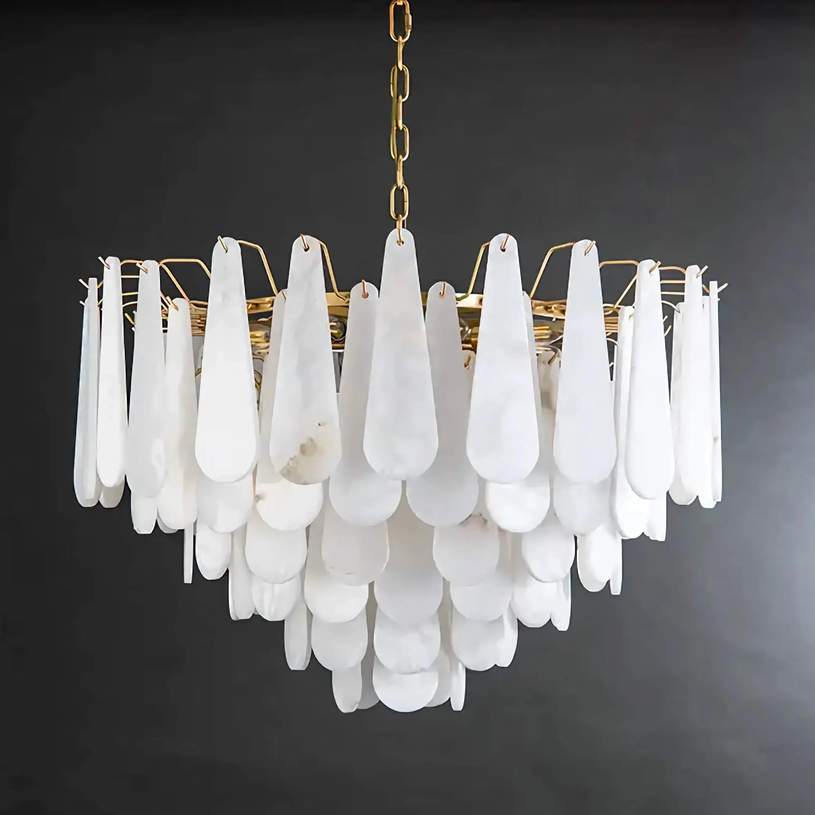 Goccia teardrop alabaster chandelier over a dining table