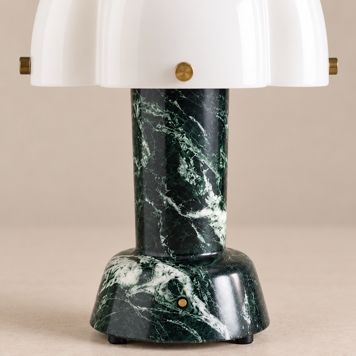Close view of the green marble base and scalloped glass shade.