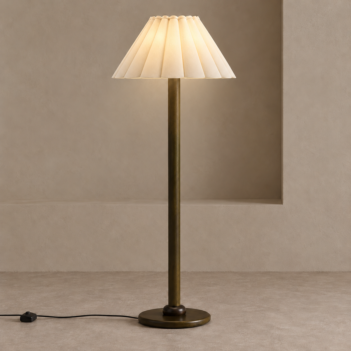 Japandi floor lamp with soft light glowing through its broad ivory pleated shade.