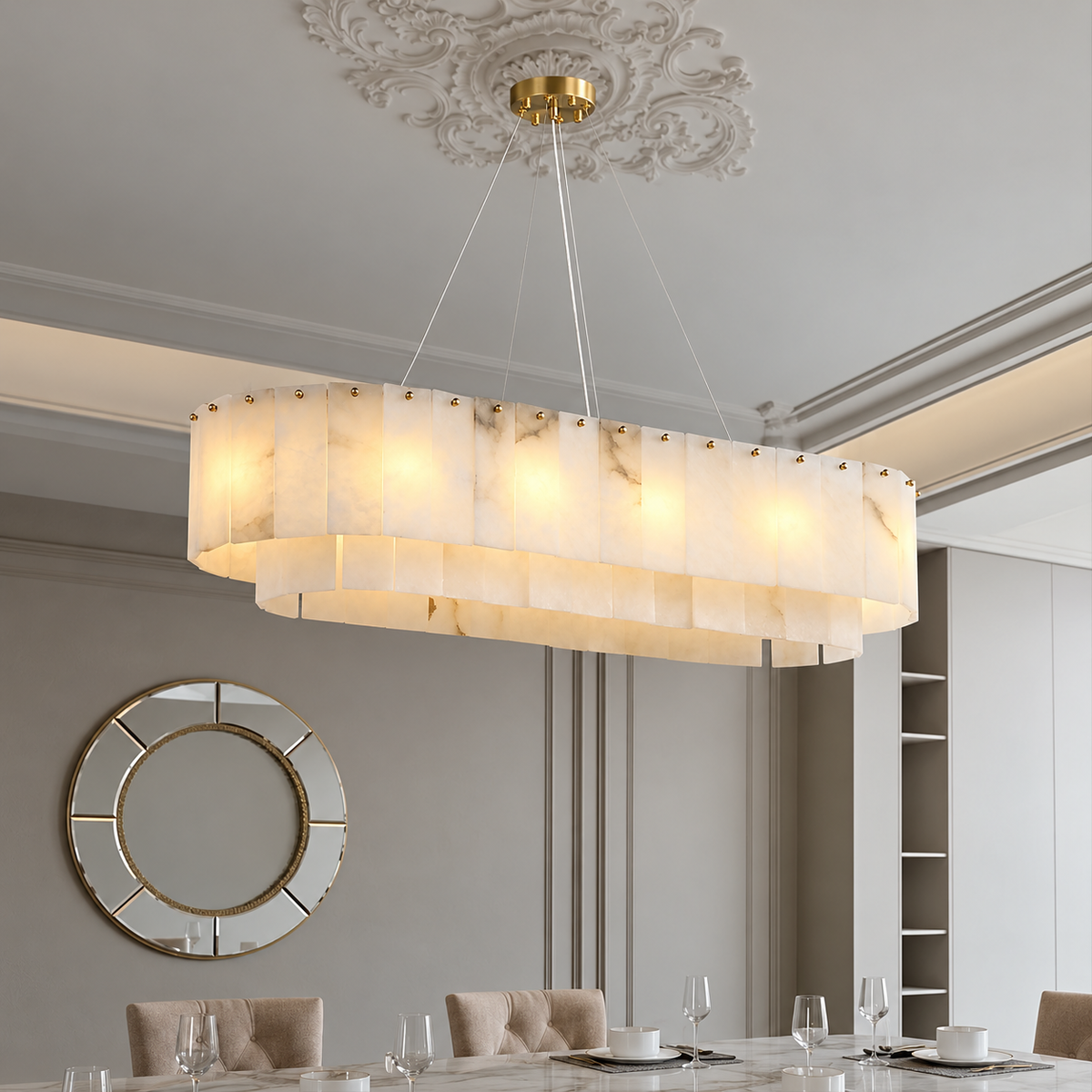 Joan alabaster chandelier above a dining table beneath an ornamental ceiling rose.