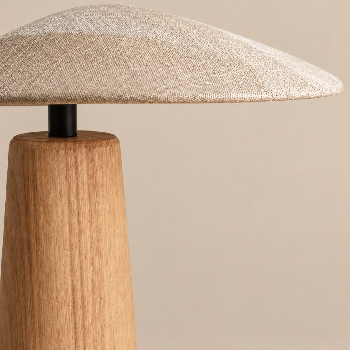 Close view of the wood grain and offset fabric shade.