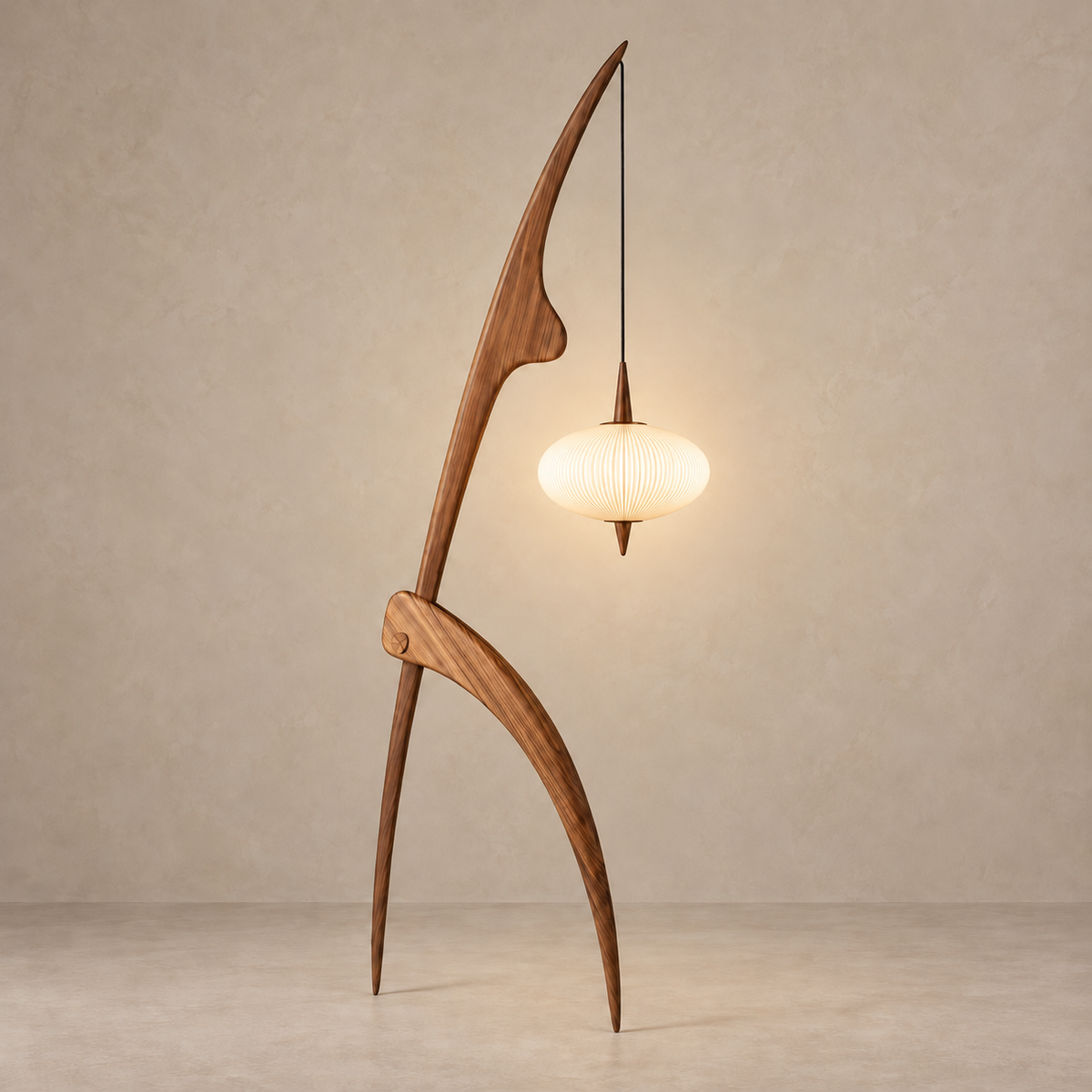 Walnut Mantis floor lamp with its suspended shade illuminated