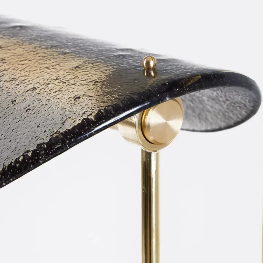 Brass and glass table lamp on a sideboard