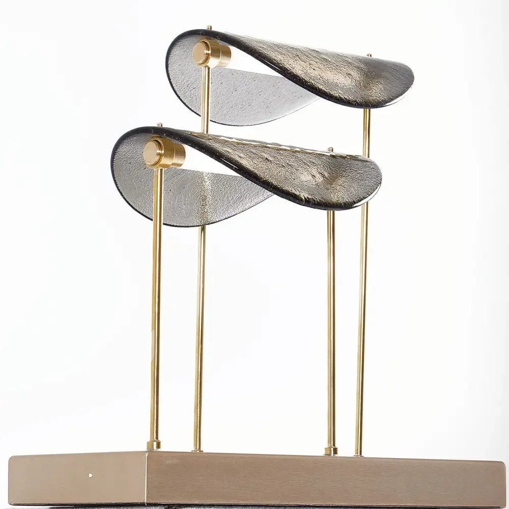Brass and glass table lamp glowing warm