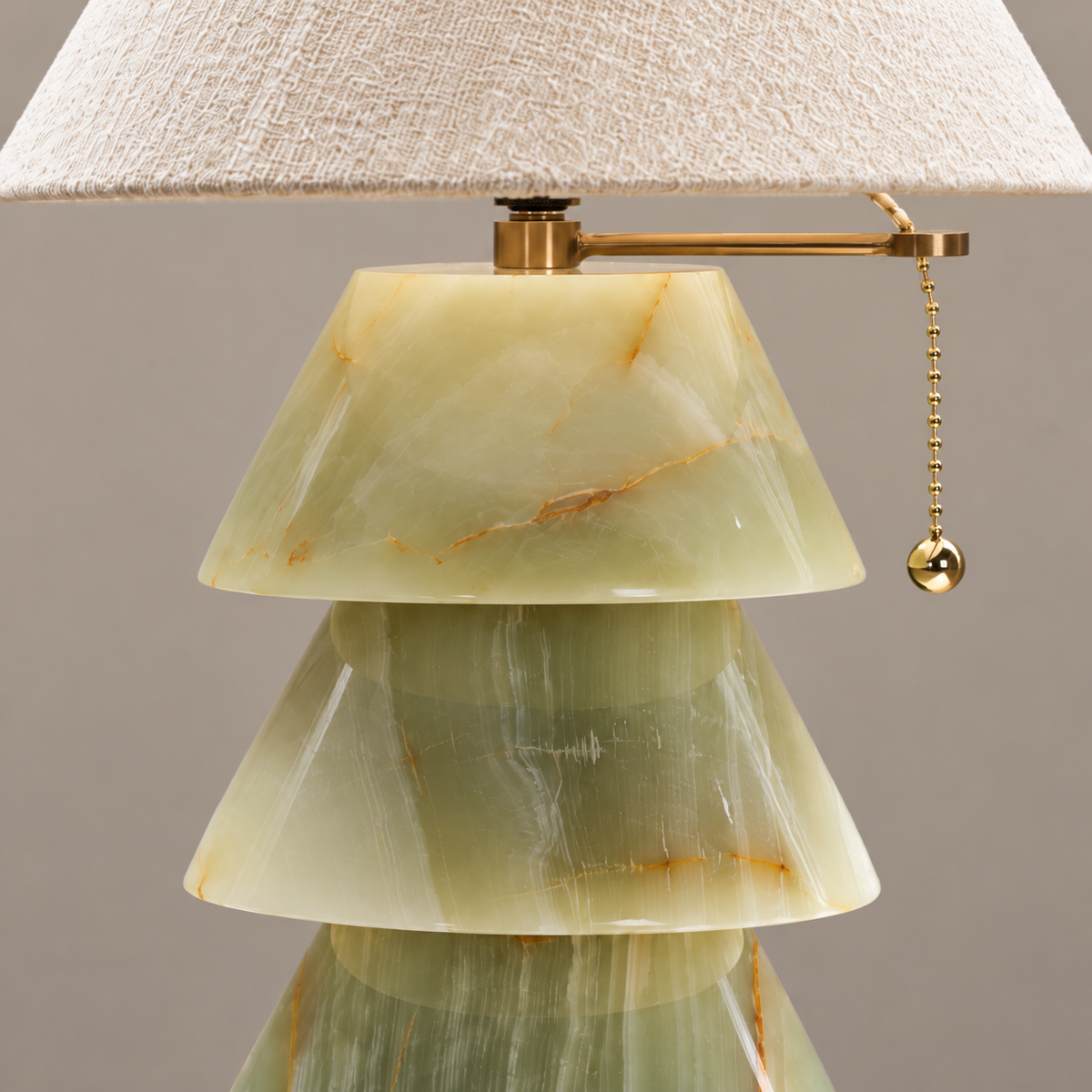 Tiered green base and brass pull-chain detail of the Pagoda table lamp