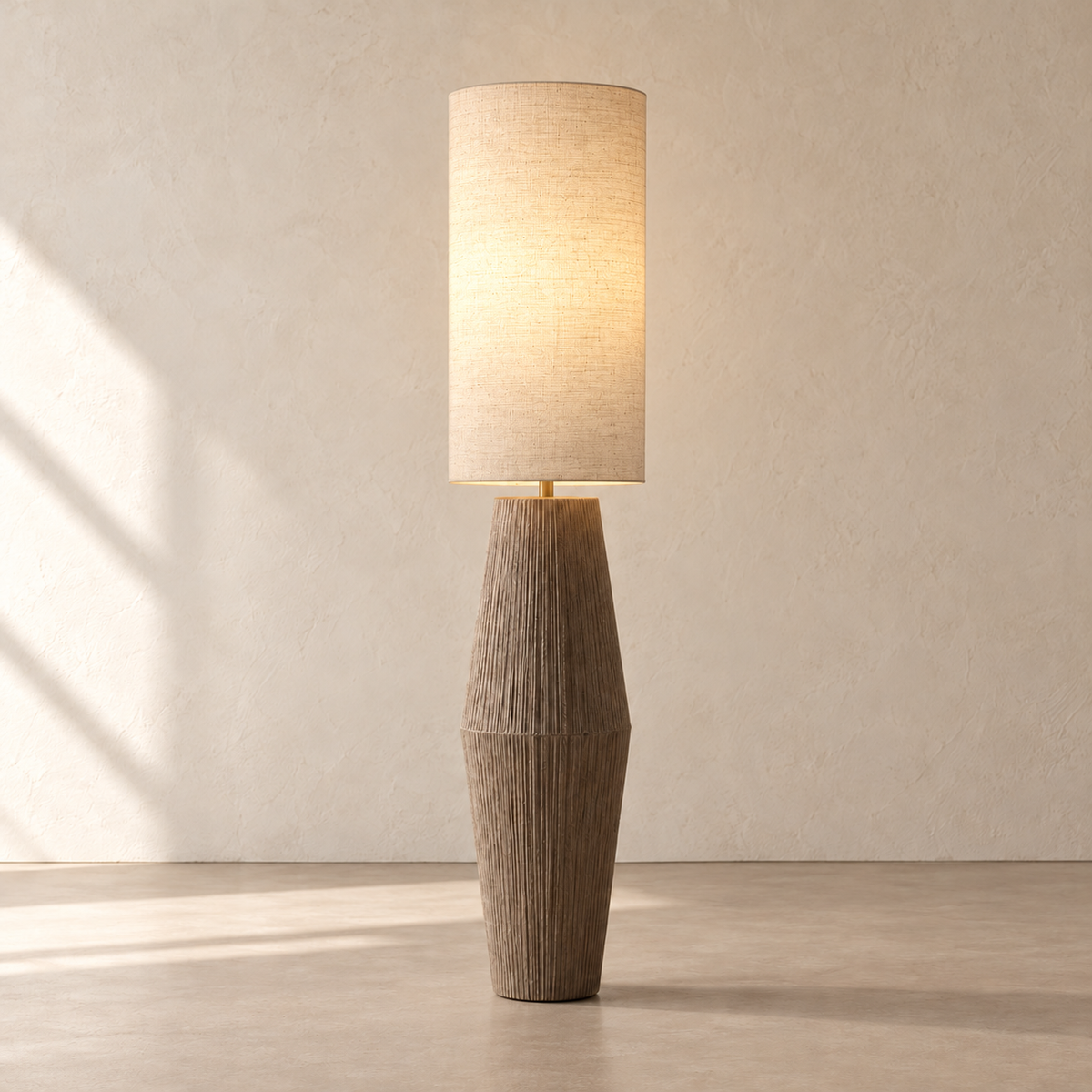 Palestrina floor lamp illuminated through its linen shade on the same beige background.