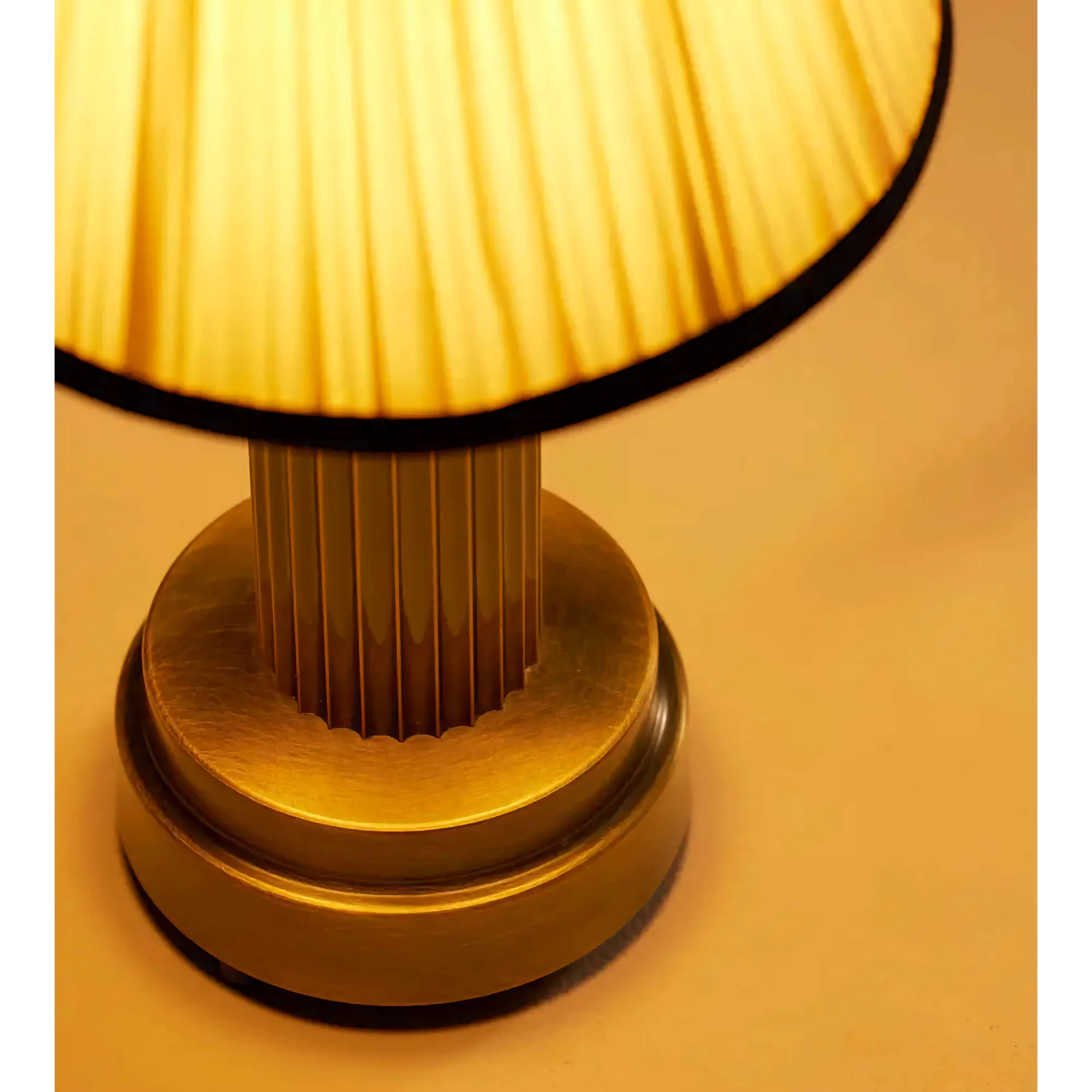 Pleated shade lamp glowing warm