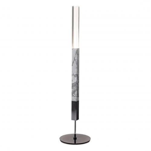 Sculptural marble torchiere floor lamp in a living room