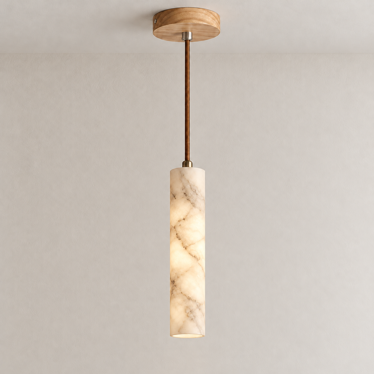Slim Stone 25 cm pendant illuminated, showing light through the same natural alabaster veins.