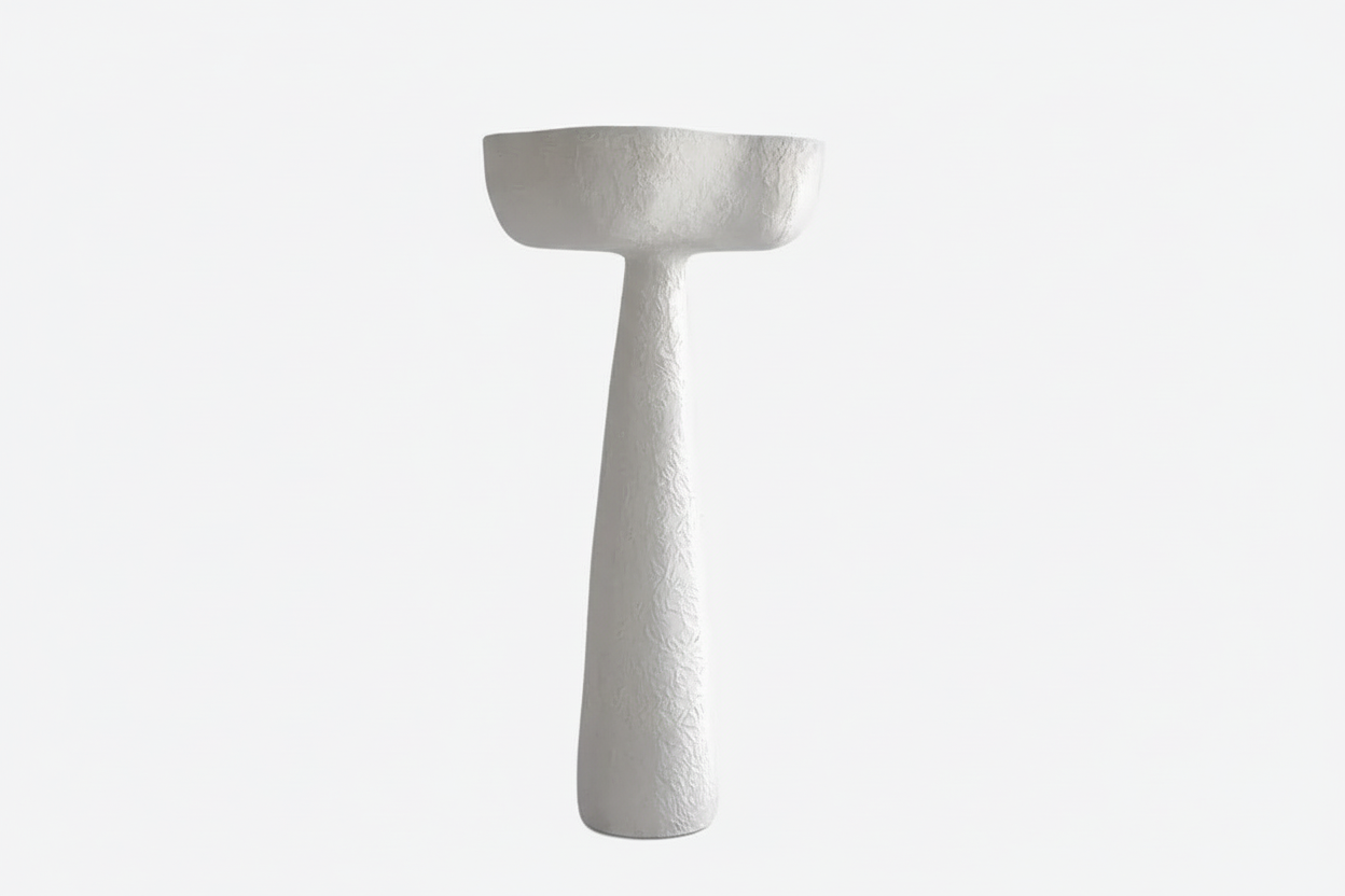 Tall plaster floor lamp in an entry