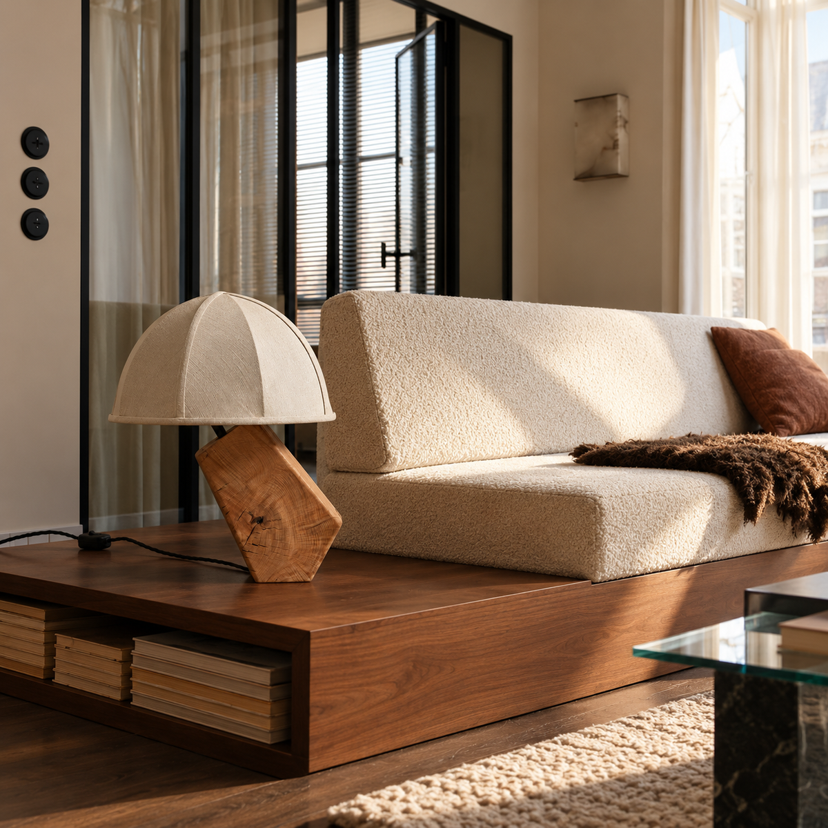 Tanaka timber table lamp on a walnut sofa platform