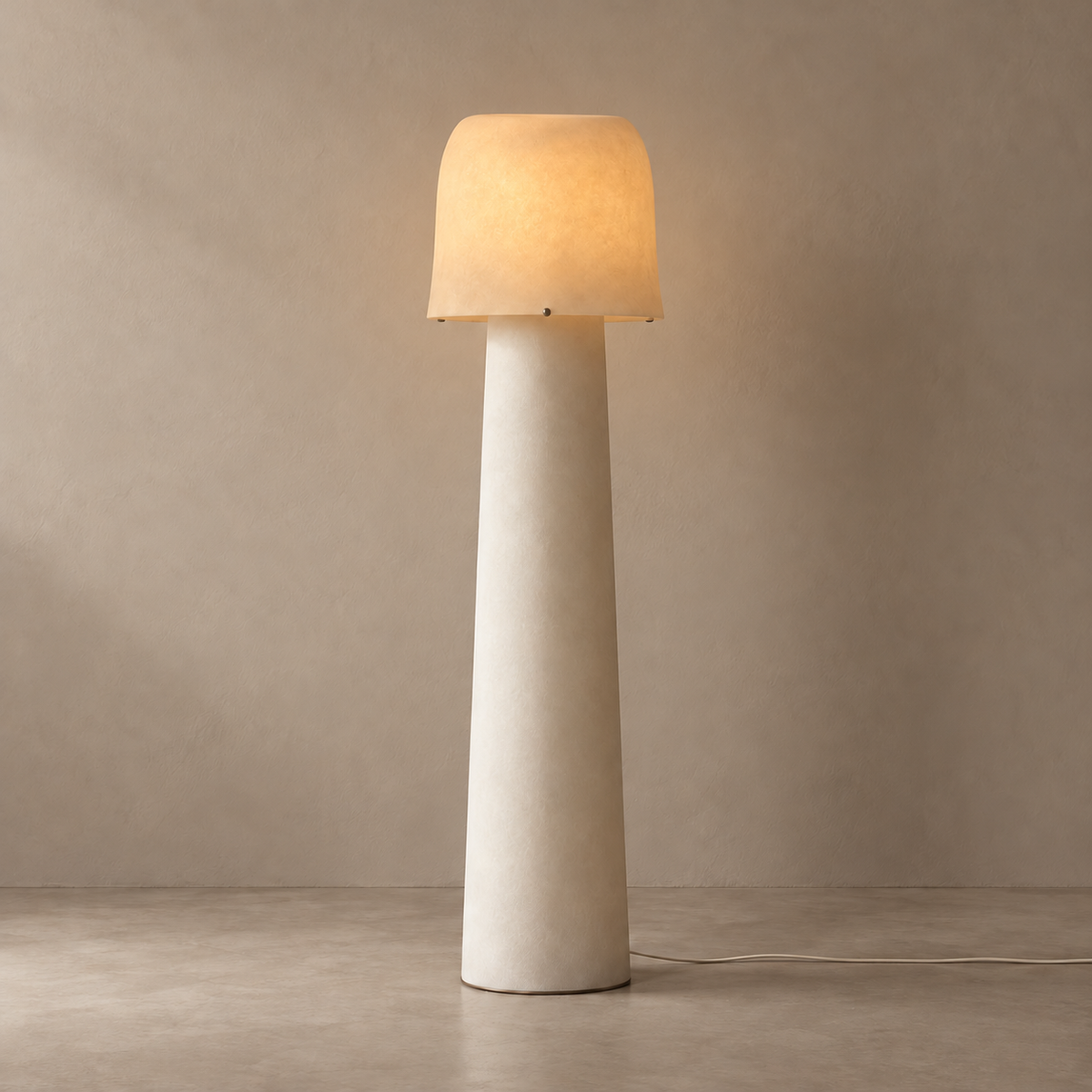 Tibur floor lamp illuminated, showing the softly translucent resin shade