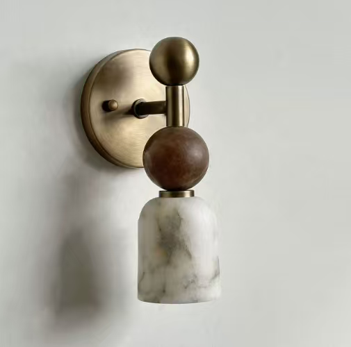 Wall sconce with brass and wooden design on a light gray background