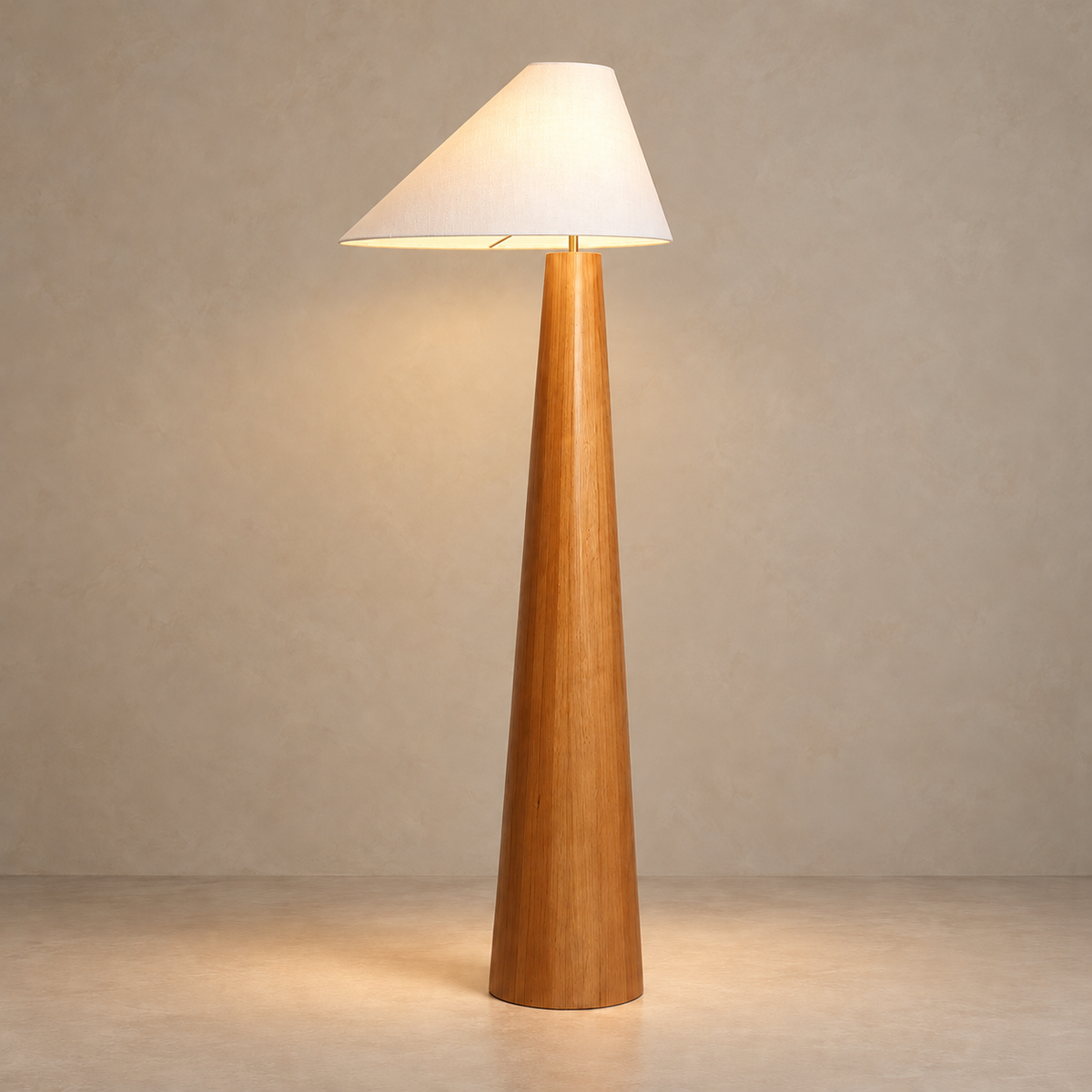 CL333320 turned wood floor lamp with its asymmetric fabric shade illuminated.