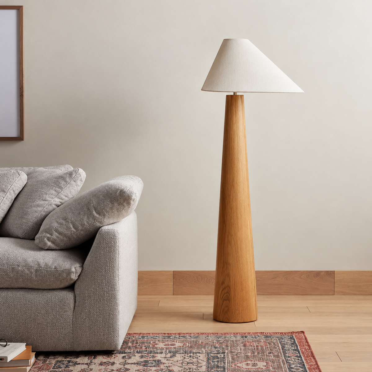 CL333320 wood floor lamp beside a grey sofa on a timber floor.