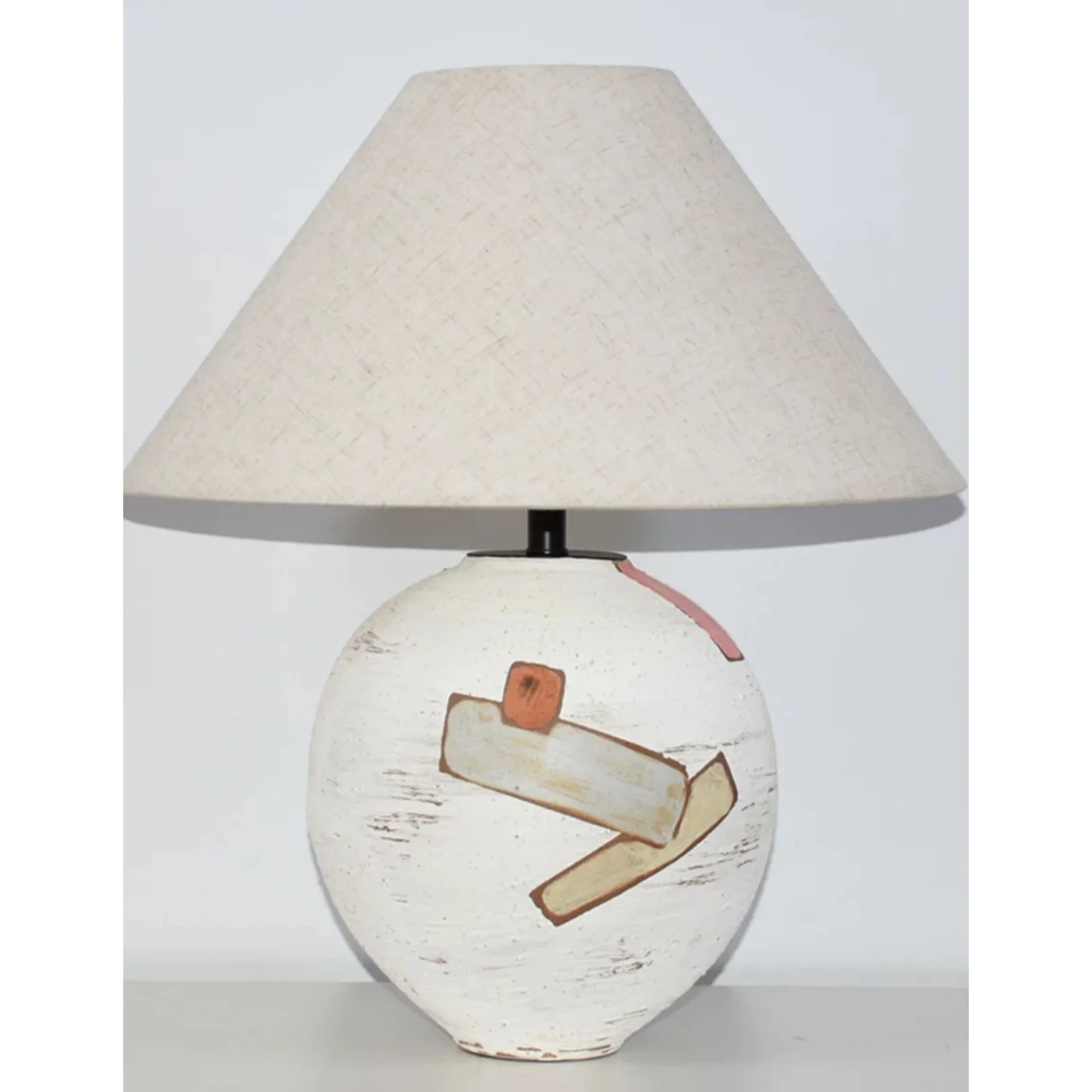 Wabi-sabi ceramic table lamp glowing warm