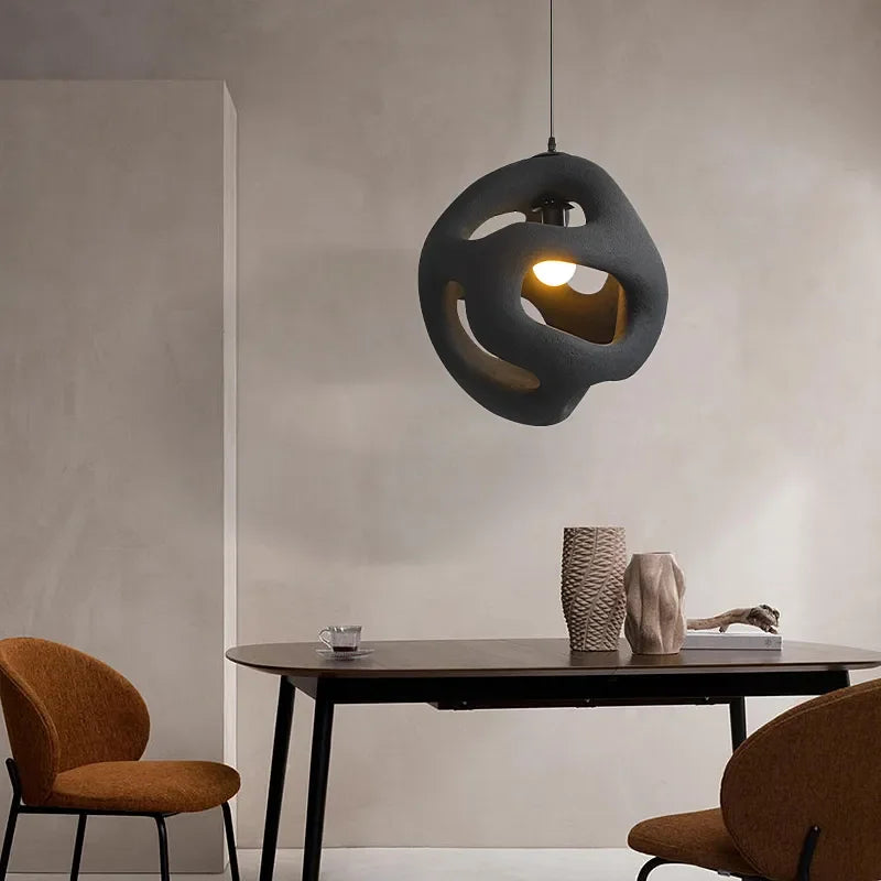 Sculptural pendant light as an art piece in a living room