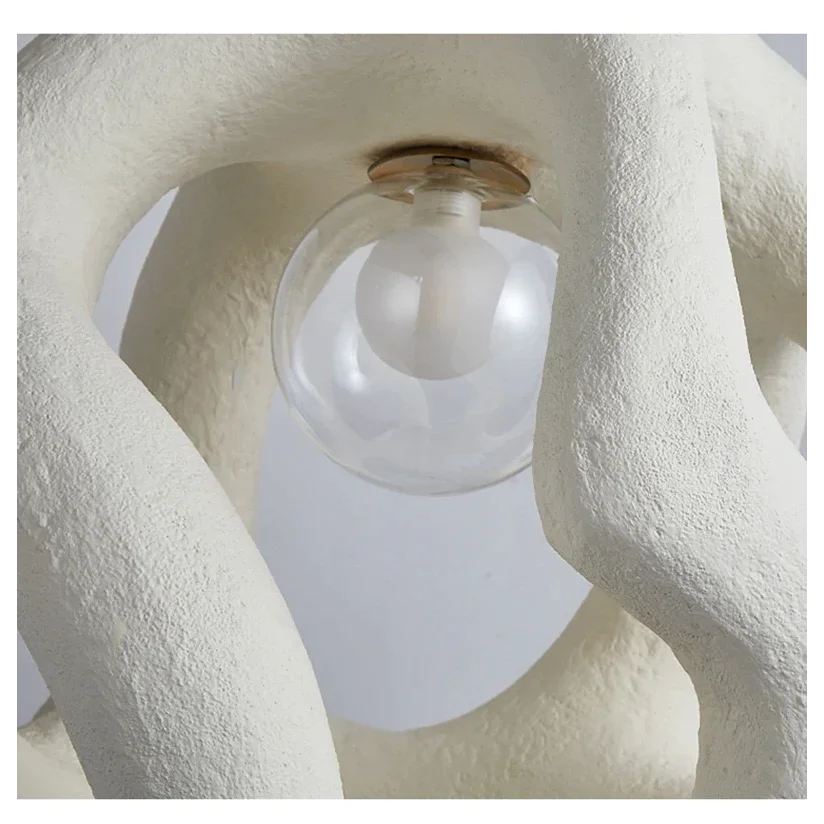 Abstract resin pendant casting a warm glow
