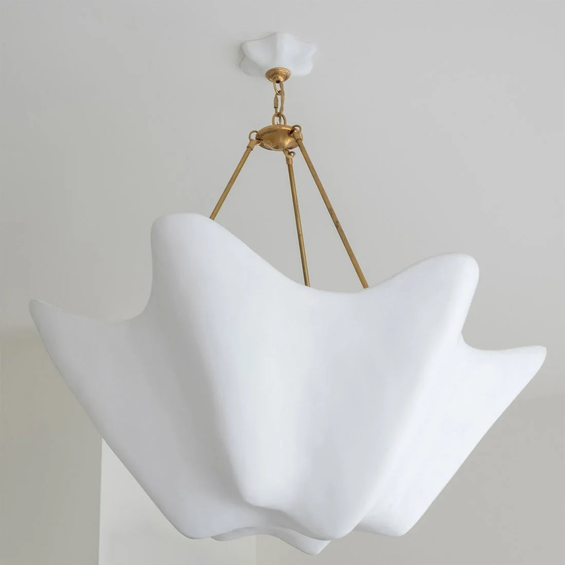 Plaster wave form and brass chain detail