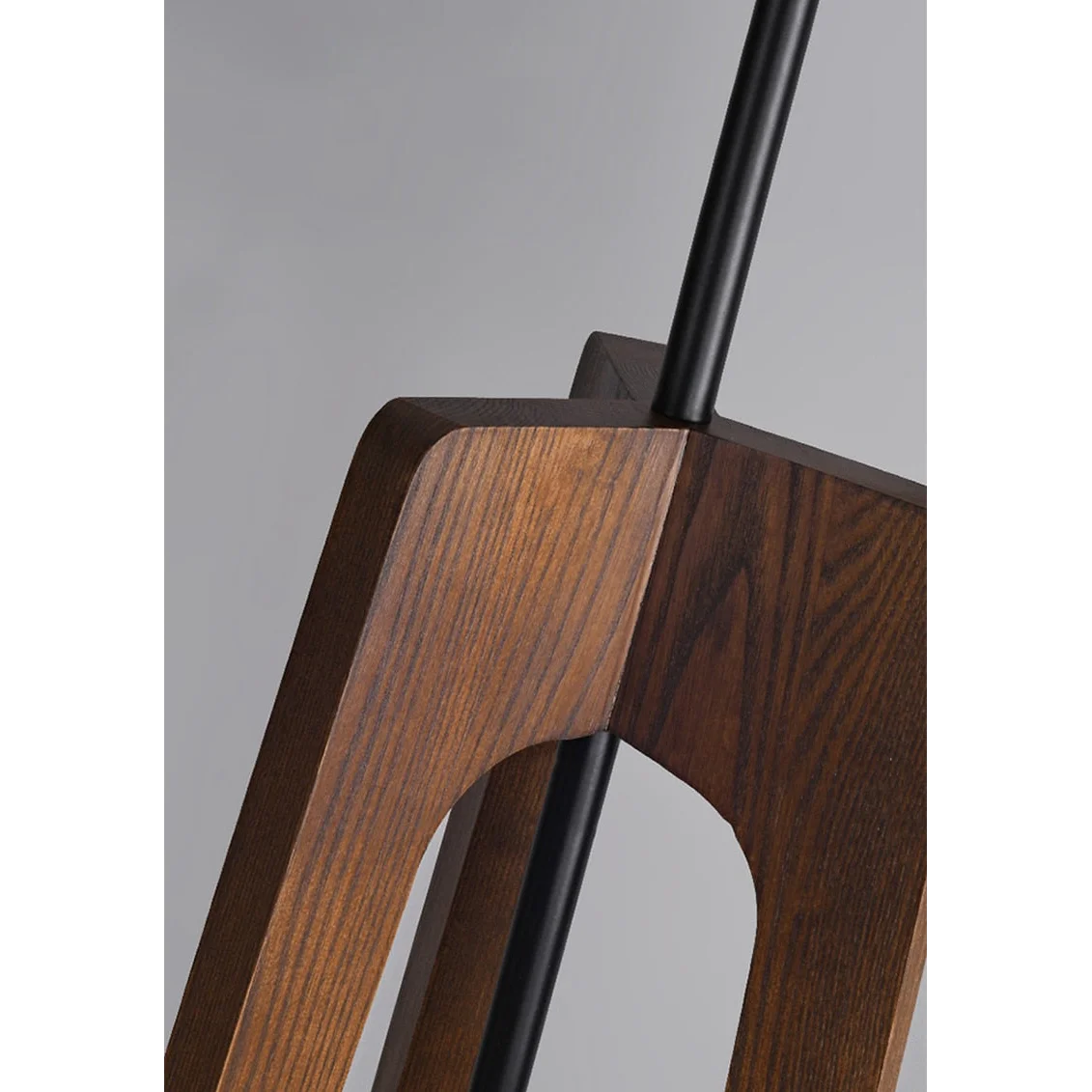 Wood tripod lamp in a bedroom