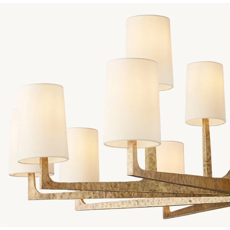 Copper and linen chandelier glowing warm